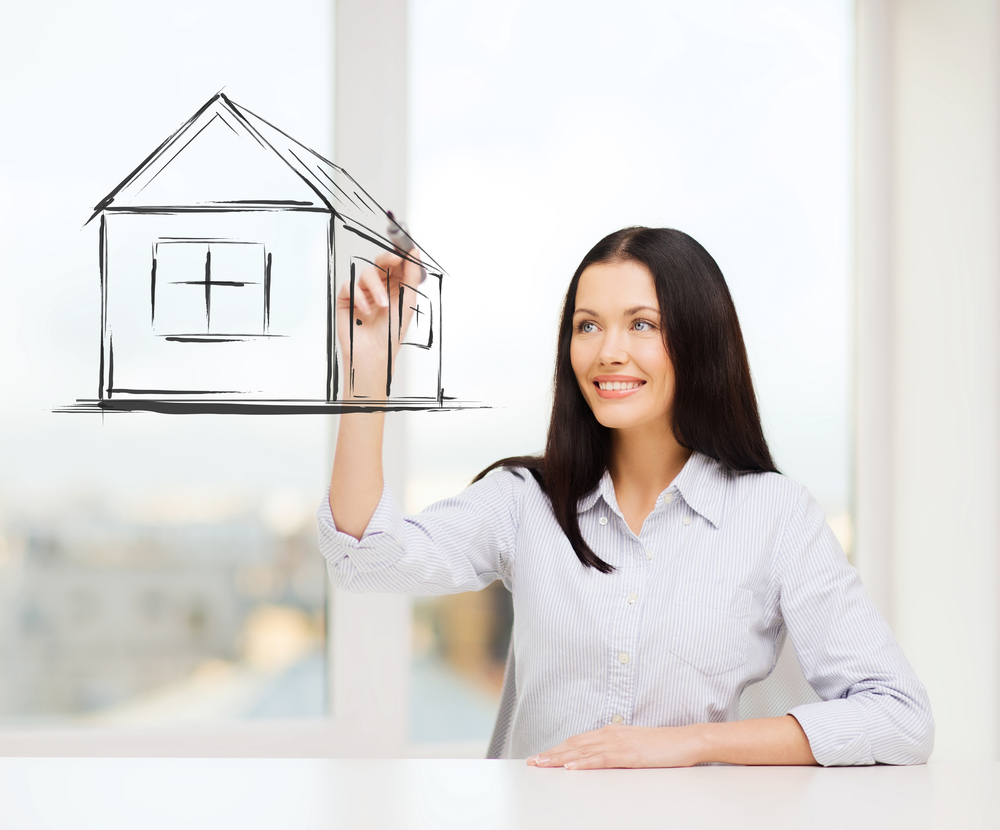 real estate, accomodation and technology concept - smiling woman drawing house on virtual screen